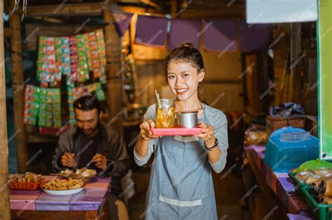 premium photo smiling female stall waitress serving traditional