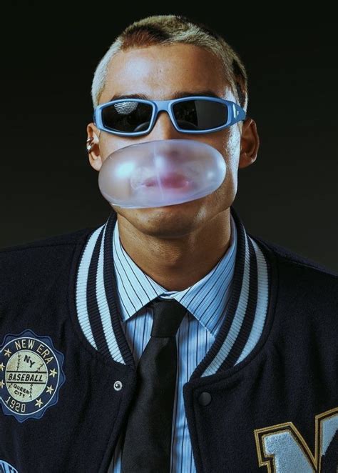 A Man Wearing Sunglasses And A Tie With Bubble Attached To His Mouth Is