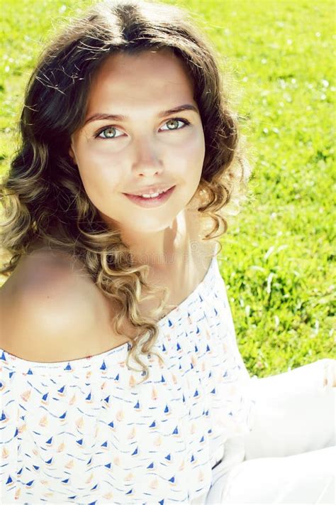 Young Cute Summer Girl On Green Grass Outside Relaxing Smiling