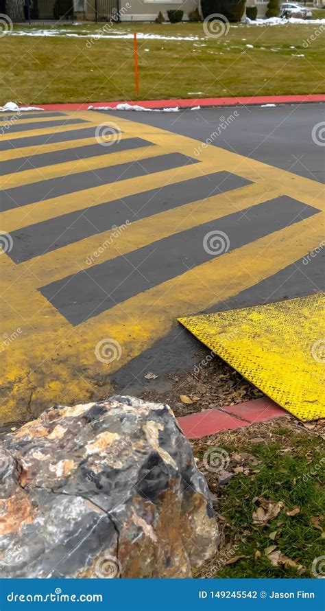 Vertical Frame Paved Road Painted With Yellow Diagonal Stripes Between