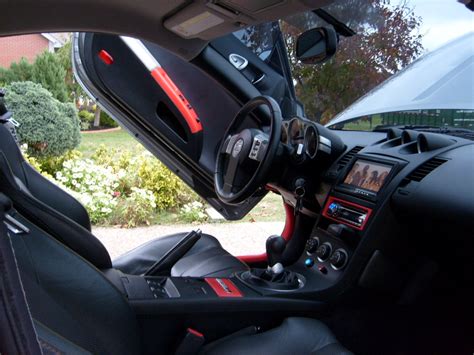 Silver Carbon Fiber On Armrest And Control Panels Painted On Doors