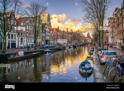 Downtown Amsterdam City Skyline Cityscape In Netherlands At Sunset