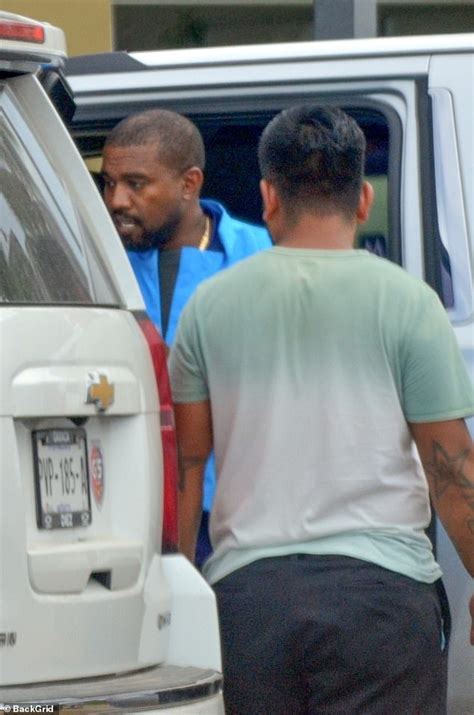 Kanye West Is On Daddy Duty As He Arrives At Mexico Airport With His