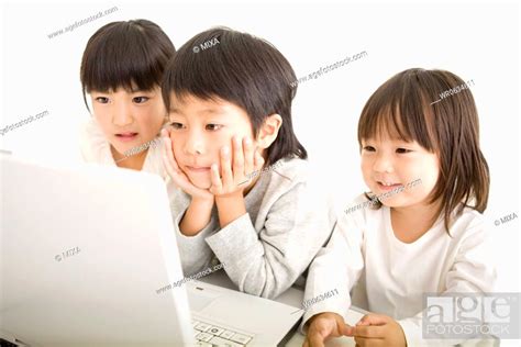 Three kids looking laptop, Stock Photo, Picture And Royalty Free Image ...