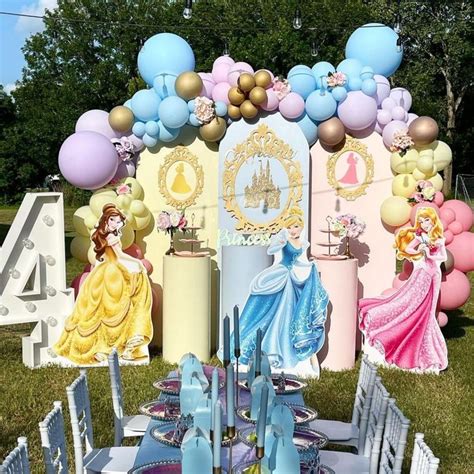 A Table Set Up For A Princess Themed Birthday Party With Balloons And