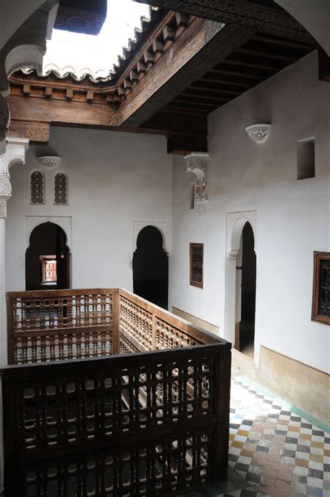 The Inside Of An Old Building With Tiled Flooring And Arches On The