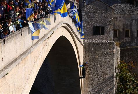 Diver Leaps From Mostar Bridge Commemorating Wartime Destruction