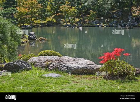 The Sogen Ornamental Pond Featuring Rocks Surrounded By Trees At The