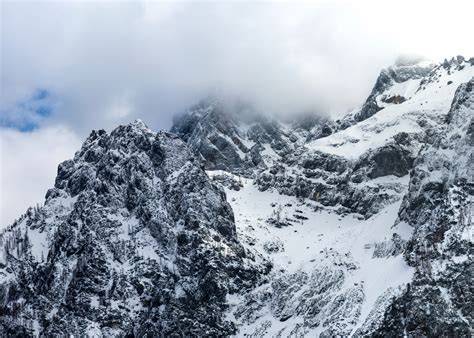 Majestic mountains below clouds - Patrik Lovrin Photography