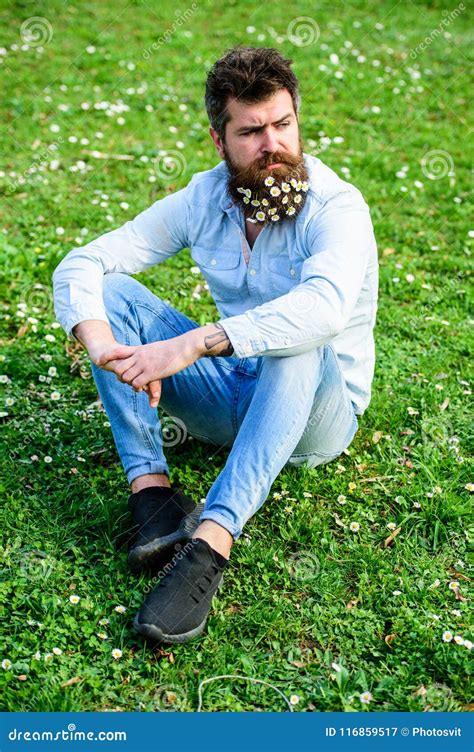 Hipster On Strict Face Sits On Grass Springtime Concept Stock Image Image Of Green Colorful