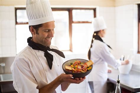 Premium Photo Happy Head Chef Presenting His Food