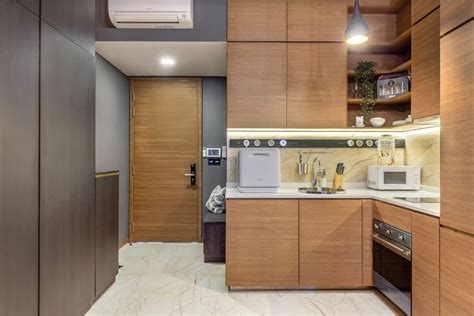 Compact L-Shaped Kitchen Cabinet Design With Modern Interiors | Livspace