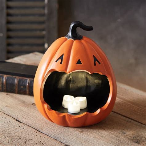 An Orange Pumpkin With Its Mouth Open And Marshmallows In It S Mouth