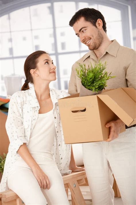 Happy Couple Unpacking Boxes In New Home Stock Image Image Of