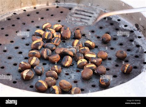 Roast chestnuts street hi-res stock photography and images - Alamy