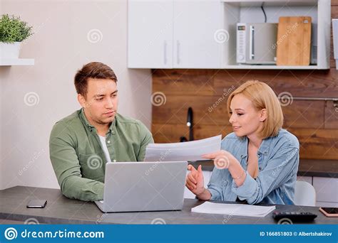 Focused Young Caucasian Couple Checking Analyzing Utilities Bills At Home Stock Image Image Of