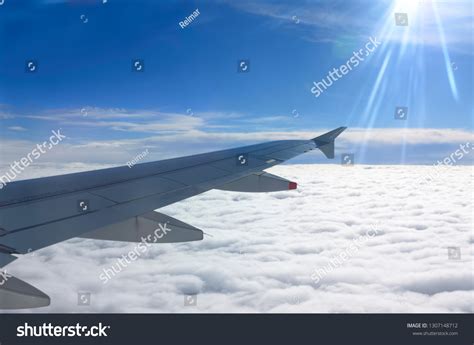 Flying Above Clouds Aircraft Wing Sun Stock Photo 1307148712 Shutterstock