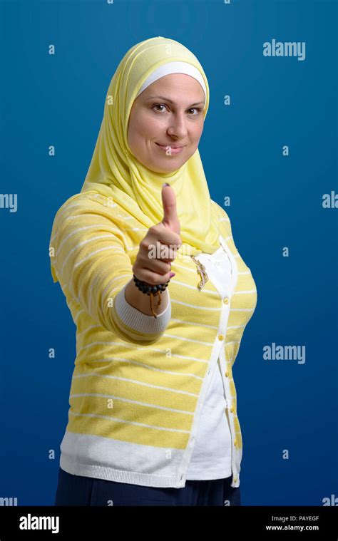 Thumbs Up Beautiful Muslim Woman Over Blue Background Stock Photo Alamy