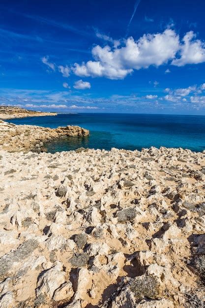 Premium Photo Sea Coast With Clear Turquoise Water And Sharp Stones