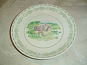 A Green And White Plate Sitting On Top Of A Counter Next To A Tile Floor