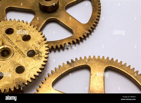 Brass Cogs On White Background Stock Photo Alamy