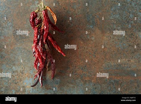Dried Red Hot Chili Pepper On An Old Rusty Background Stock Photo Alamy