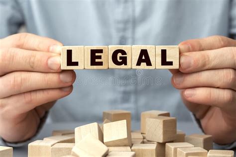 The Word LEGAL Made From Wooden Cubes Shallow Depth Of Field On The