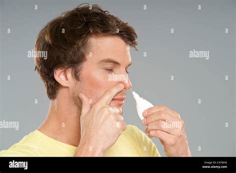 Man Using Nasal Spray Stock Photo Alamy