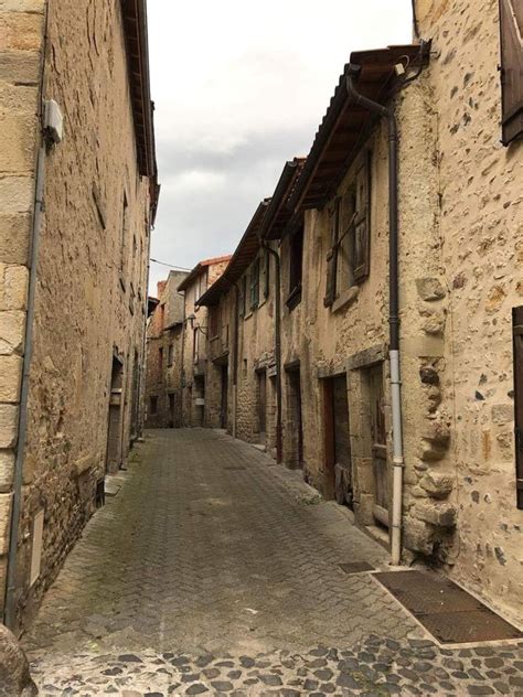 An Alley Way With Stone Buildings And Cobblestones