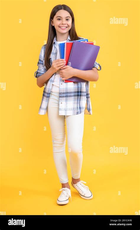 Full Length Of Teen School Girl With Notebook Teen School Girl Isolated On Yellow Teen School