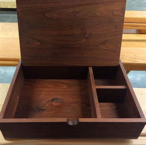 An Open Wooden Box Sitting On Top Of A Table