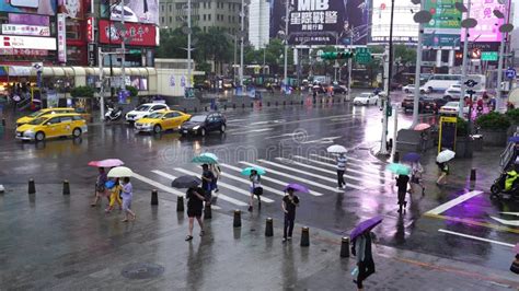 People Crossing Street In Front Of Ximending Shopping District With