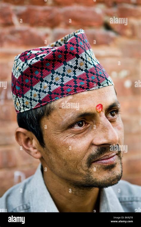 Portrait Of A Nepali Man Wearing A Traditional Hat Stock Photo Alamy