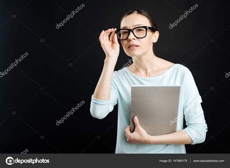 Attentive Female Holding Her Glasses Stock Photo By Yacobchuk1 147965179