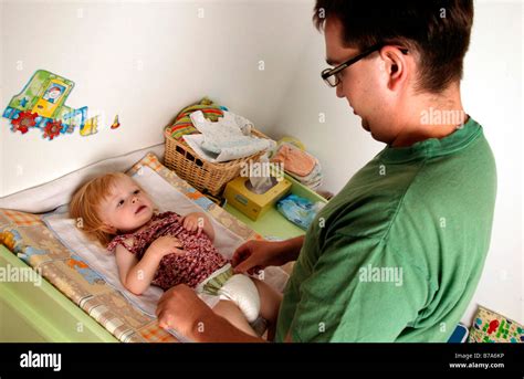 Nappy change three year old hi-res stock photography and images - Alamy