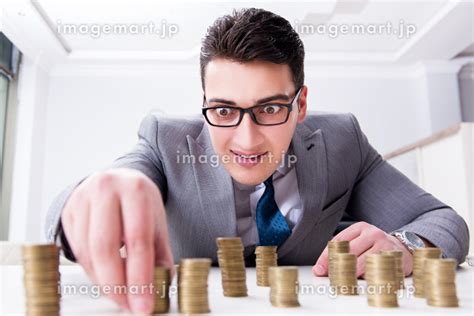 Businessman With Golden Coins In Business Growth Concept The