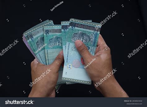 Hands Counting Money Male Holding Malaysia Stock Photo 2034921932