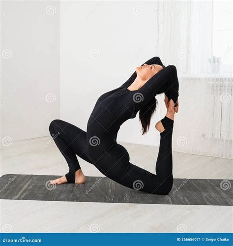 A Woman Leading A Healthy Lifestyle And Practicing Yoga Performs A