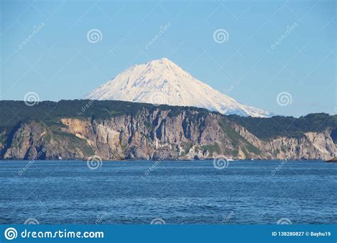 Koryaksky Volcano Rises Above The Coastline Of The Kamchatka Peninsula