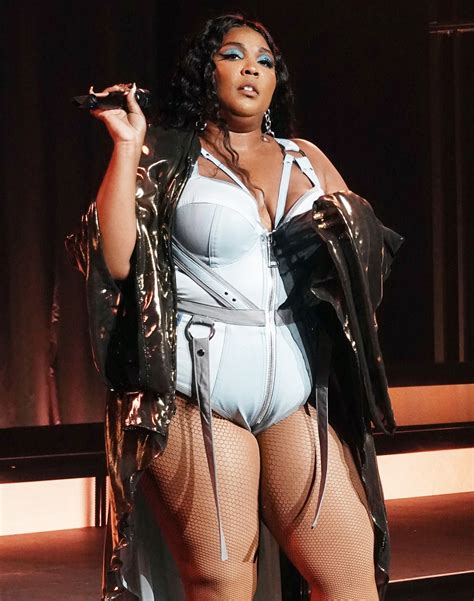 Lizzo Flaunts Her Curves In Blue Bodysuit During Miami Beach Concert