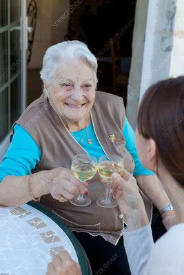 Elderly Woman Drinking Wine Stock Image C033 0543 Science Photo