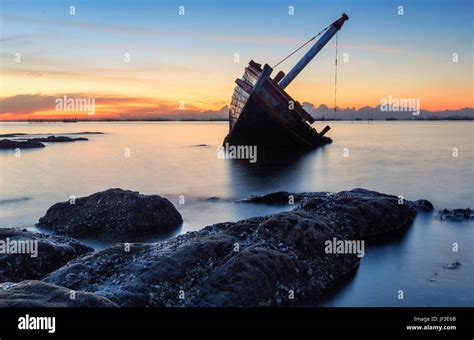 An Old Shipwreck Or Abandoned Shipwreck Taken During A Beautiful Sunset