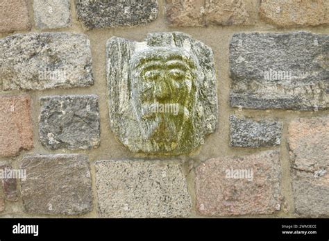 Engravings And Bas Reliefs Depicting Grotesque Human And Devil Masks On