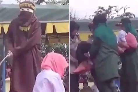 Horrific Pictures Show Woman Being Savagely Whipped By Masked Sharia Law Enforcer For Having