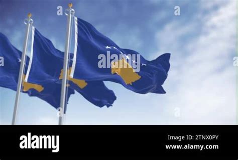 Three National Flag Of Kosovo Waving In The Wind On A Clear Day Six