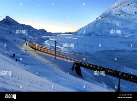 The Bernina Express Unesco Heritage Passes To The Bernina Pass At Dusk