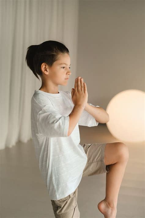 A Child Practices Yoga Poses Indoors Childrenand X27s Yoga Stock Image
