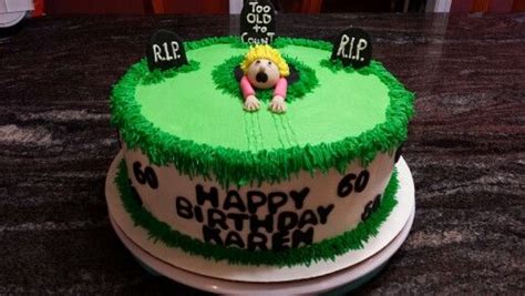 A Birthday Cake With Green Frosting And Decorations