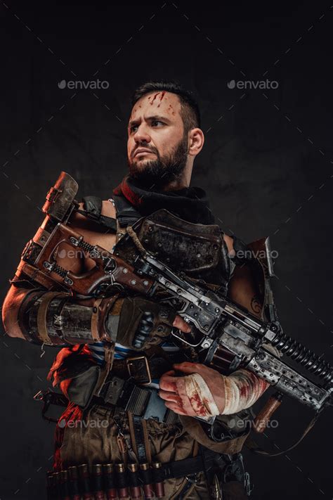 Damaged Survivor With Bandaged Arm Holding Shotgun Stock Photo By Fxquadro