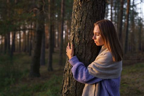 Premium Photo Loving Nature Concept Relaxed Woman Hugging Tree Trunk